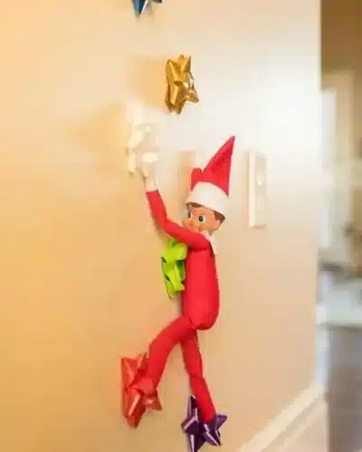 50 Last Minute Elf on the Shelf ideas-Bow climbing