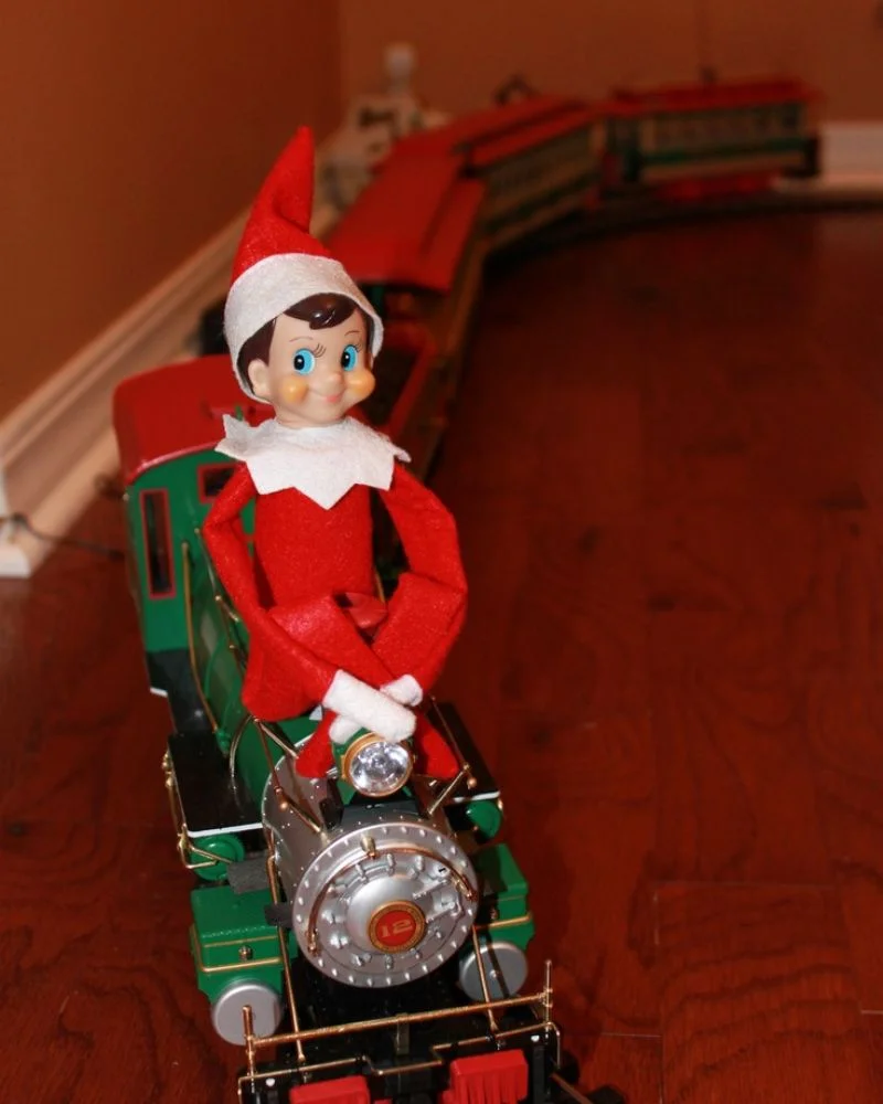 50 Last Minute Elf on the Shelf ideas-Riding on Santa’s Train
