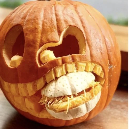 50 Best pumpkin carving ideas for Halloween and What type of pumpkin is used for Halloween?-Pumpkin Eating a Burger