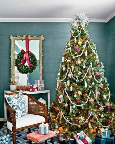 35 Best Merry Christmas Eve Traditions to Make Lasting Memories Christmas Eve 2022-Take a photo in front of the tree